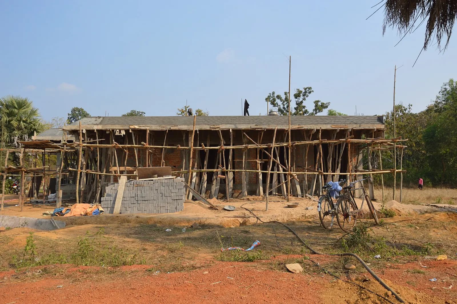 Building under construction with bamboo scaffolding